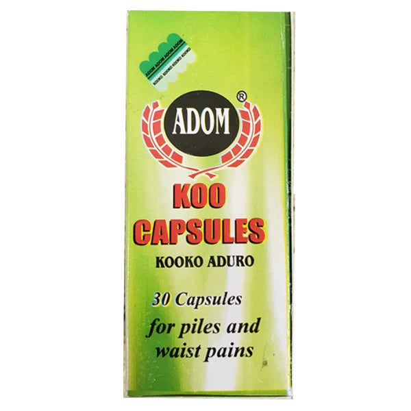 Green bottle and matching box of Adom Koo herbal capsules — a Ghanaian herbal supplement for relief from constipation, piles, waist pains, and excess phlegm.
