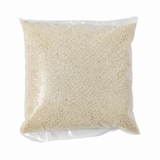 Aklui small-grain corn porridge granules in a clear bag
