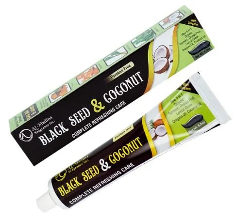 Two tubes of Al-Madina Black Seed & Coconut Toothpaste with black seed and coconut illustrations on the packaging.