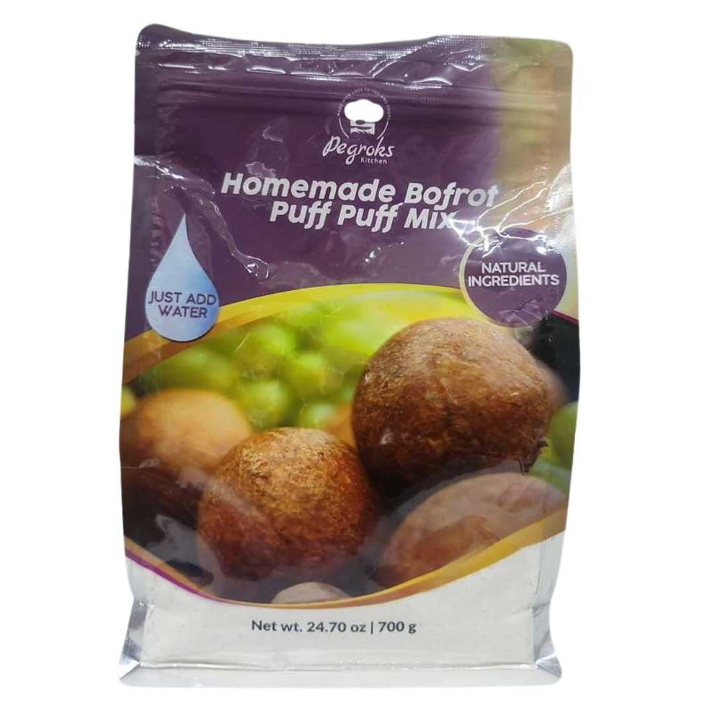 Degroks Kitchen Homemade Bofrot Puff Puff Mix – 700 g (24.70 oz) resealable pouch. The front label features golden-brown puff puff balls with a green background. The purple header displays the Degroks Kitchen logo and product name with text bubbles reading “Just Add Water” and “Natural Ingredients.”