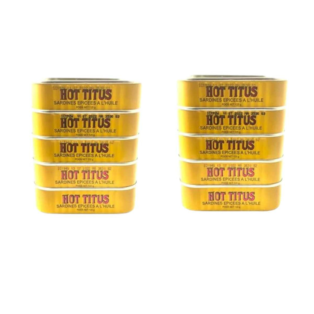 Multiple cans of Hot Titus spice mix on a white background