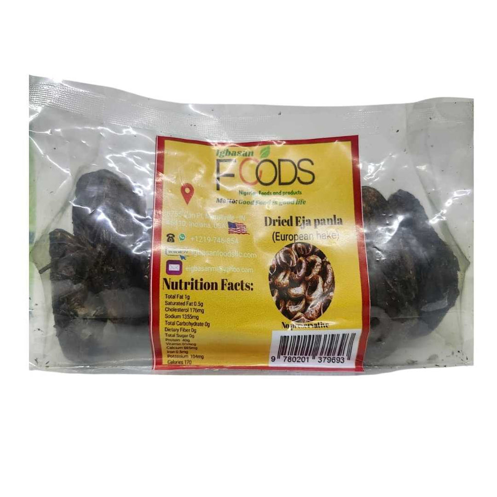 Clear plastic package of Igbasan Foods Dried Eja Panla (European Hake) showing dried fish pieces inside. The yellow and red label displays the brand name, product title, nutrition facts, contact information, and a barcode on the lower right.