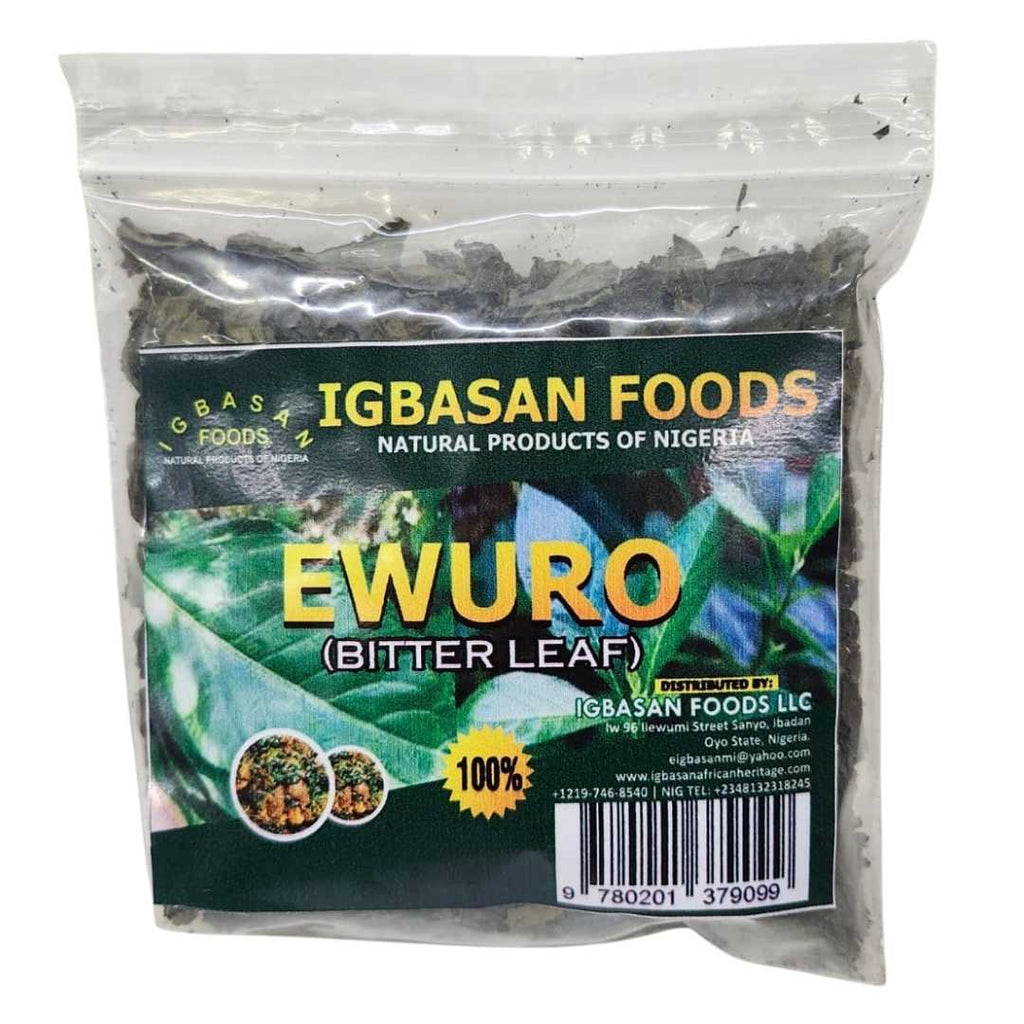 A clear plastic bag of Igbasan Foods Ewuro (Bitter Leaf) showing dried green leaves inside. The front label is green with yellow text, featuring images of traditional Nigerian dishes, the Igbasan Foods logo, and a barcode.