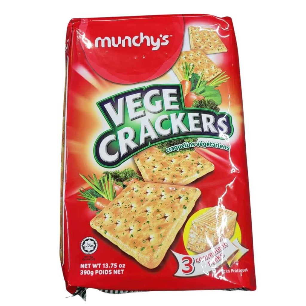 Bag of Munchy’s Vege Crackers featuring square vegetable-flavored crackers with herbs and vegetables illustrated on the red and green packaging.