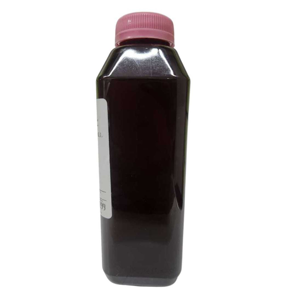 Natural Honey (Small) bottle – clear plastic container filled with dark amber honey, sealed with a pink screw cap and labeled “Natural Honney – Small” with barcode and price tag.