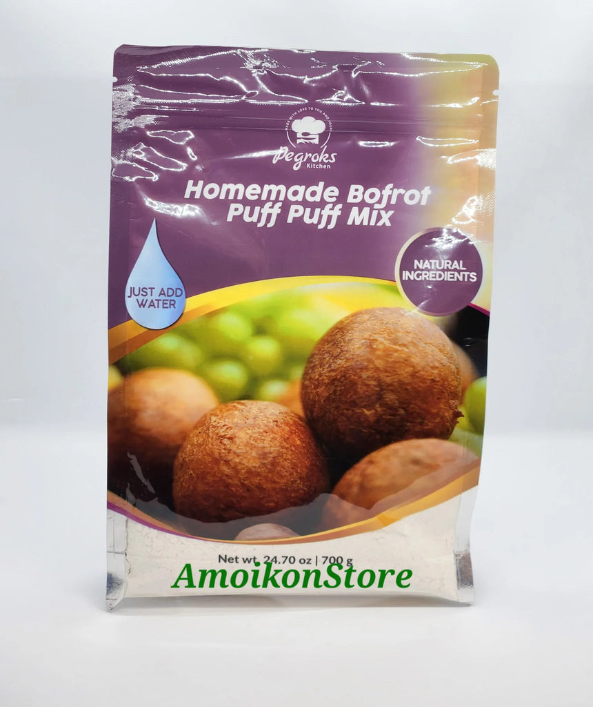 Degroks Kitchen Homemade Bofrot Puff Puff Mix – 700 g (24.70 oz) resealable pouch. The front label features golden-brown puff puff balls with a green background. The purple header displays the Degroks Kitchen logo and product name with text bubbles reading “Just Add Water” and “Natural Ingredients.”