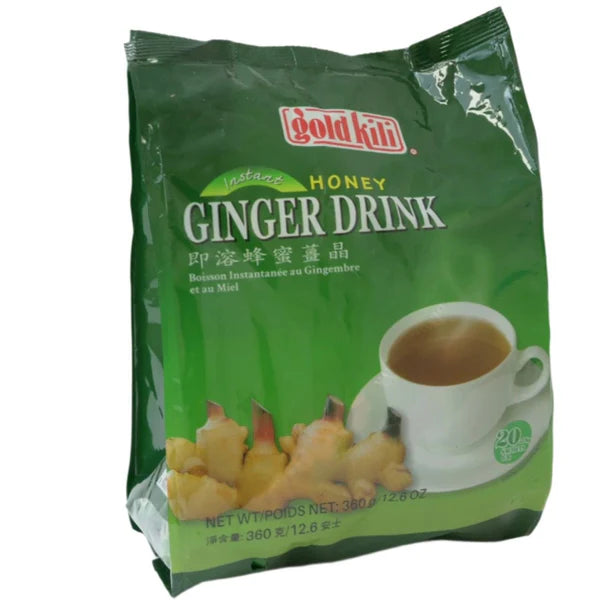 Box of Instant Honey Ginger Tea, featuring images of fresh ginger roots, a honey dipper, and a steaming cup of tea on the packaging.