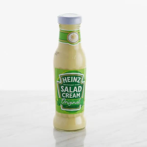 Heinz Salad Cream Original – Bottle of creamy, tangy salad dressing with a green label, placed on a white surface.